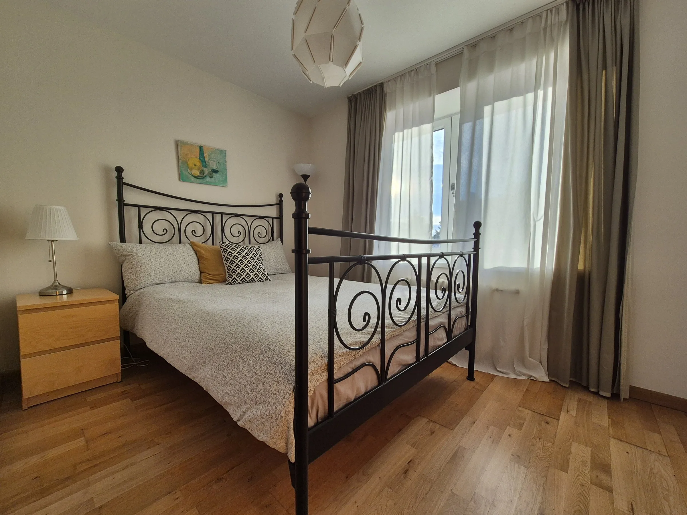 Bedroom with a wrought-iron double bed